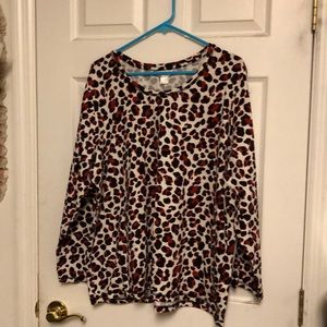 White, black, red long sleeve animal print top.